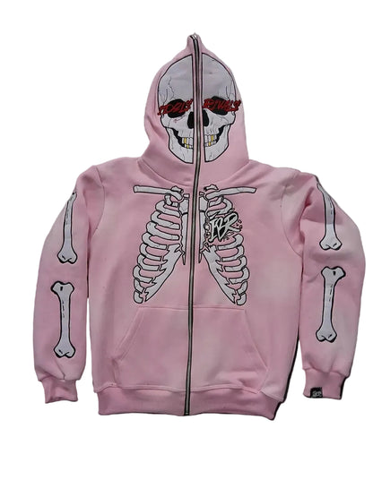 Pink hoodie with skeleton design on a textured black background